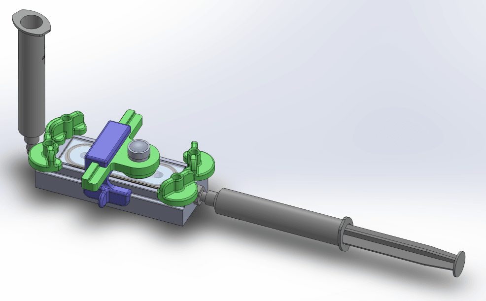 CAD mock-up of the full assembly: a wedge device with green clamps, a lens housing, and syringes at both ends